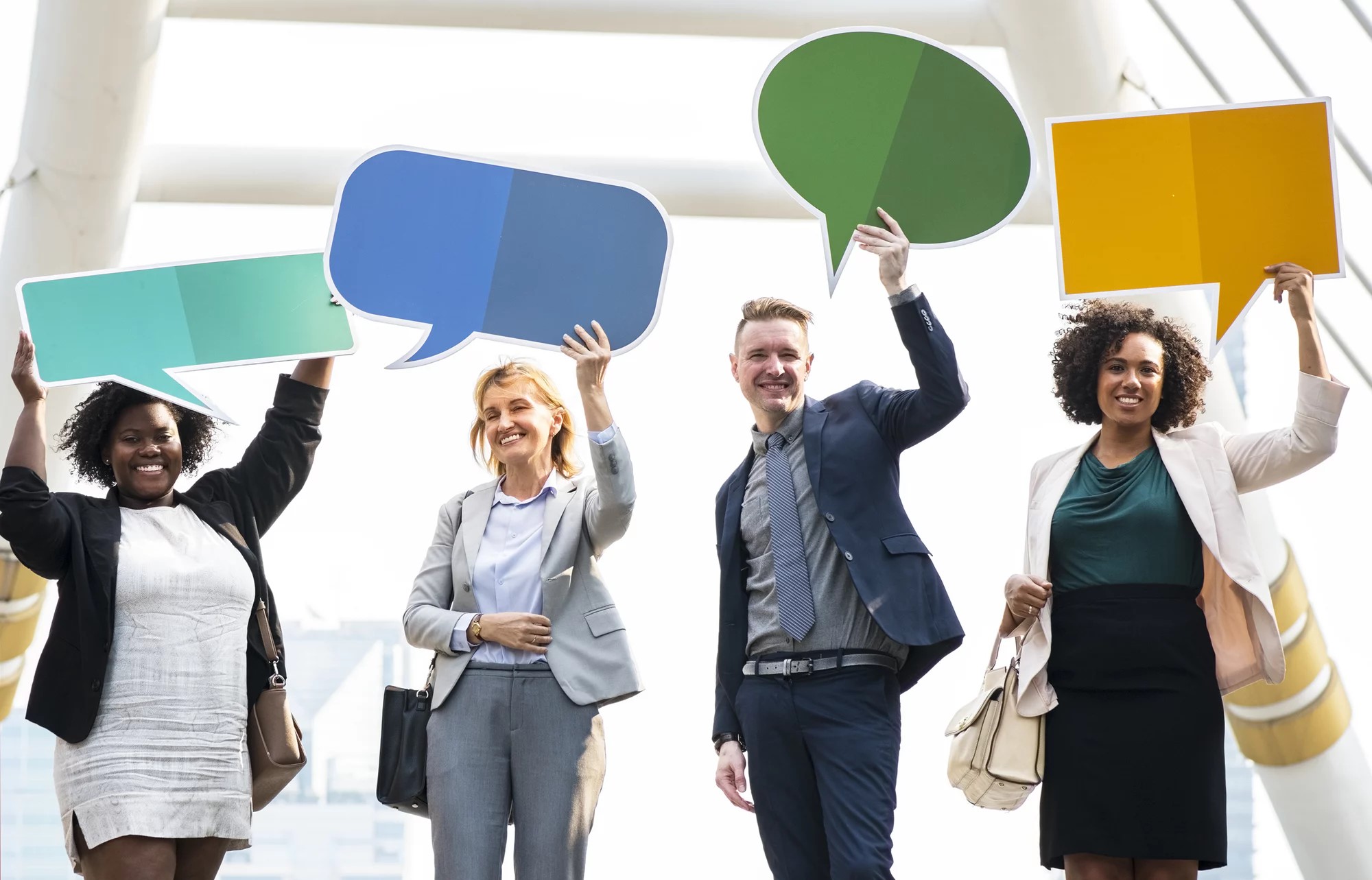 Group of people holding chat boxes