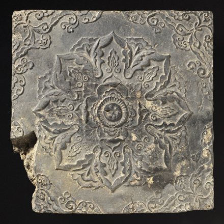 Molded earthenware tile depicting a stylized lotus blossom. From Korea, Unified Silla dynasty late 7th-8th century