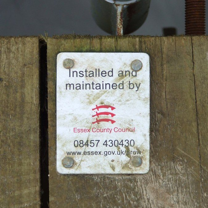 Sign on wooden wall, stating Installed And Maintained By